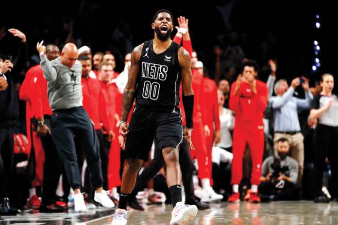 Brooklyn Royce O'Neale reacts after scoring the go-ahead basket for Brooklyn Nets against Miami Heat. GETTY IMAGES