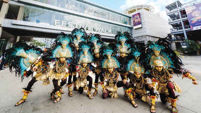 Megaworld-photo Dinagyang warriors from the Iloilo Artists Festival Association conduct final rehearsals at Festive Walk Iloilo in preparation for today’s Dinagyang festivities. The 72-hectare Iloilo Business Park township in Mandurriao district is hosting the grandest and most exciting events of the Dinagyang Festival 2023 including the finale of the Dinagyang ILOMINATION Showdown, Dinagyang Floats Parade of Lights, the Grand Fireworks Display, and the Dinagyang Music Festival from Jan. 21 to 22.
