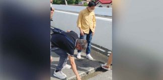 Kabataan party-list’s Cong. Raoul Manuel (standing) inspects the P680-million, four-lane Ungka flyover in Barangay Ungka II, Pavia, Iloilo on Jan. 6. He says in the short time the flyover was opened, he experienced firsthand its uneven, or “wavy” decking. PANAY TODAY FACEBOOK PHOTO