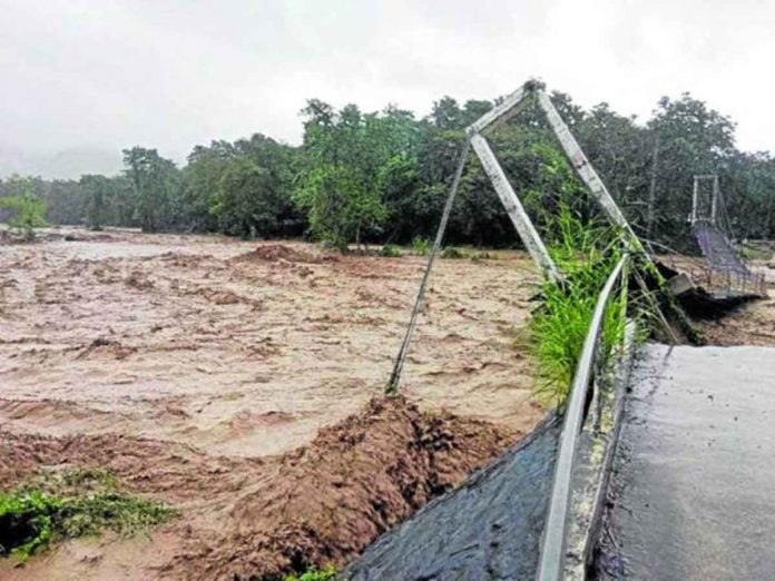flood A massive flood triggered by a low pressure area and the northeast monsoon rages through Brooke’s Point, Palawan, causing the Cabinbin hanging bridge in Barangay Imulnod to collapse on Tuesday due to the strong current. CONTRIBUTED PHOTO