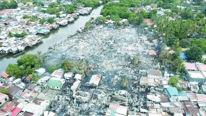 front banner pic and caption TOTALLY SCORCHED. The extent of destruction left by the predawn fire that hit barangays West Habog-Habog and San Juan in Molo, Iloilo City on Saturday, Jan. 28, is seen in this drone shot. ILOILO CITY ARCHITECT'S OFFICE PHOTO