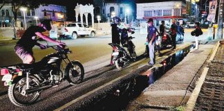 ANTI-ILLEGAL MUFFLERS OPERATION. Personnel of the Iloilo City Police Office and Public Safety and Transportation Management Office flag down motorcycles along the Diversion Road in Mandurriao district to inspect their mufflers. Modified mufflers are illegal. PSTMO PHOTO