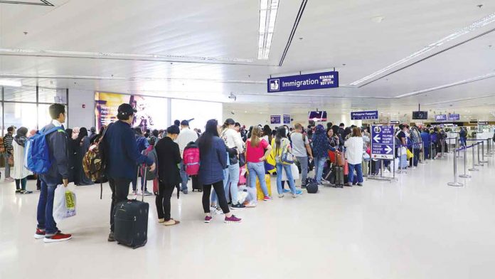 naia Travelers queue at the Ninoy Aquino International Airport immigration counters. TOURISM.GOV.PH PHOTO