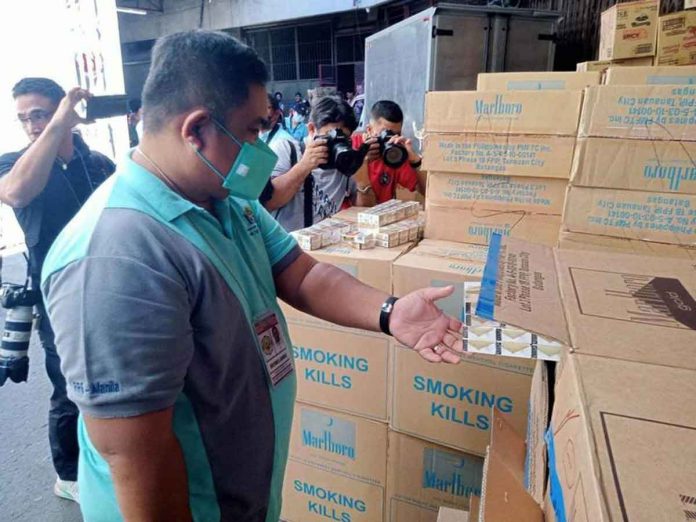 Authorities swooped down on 21 provinces and 69 cities and municipalities nationwide, specifically wholesalers and retailers that were selling illicit cigarettes, and confiscated millions worth of illegal cigarettes that are untaxed, fake and smuggled. PHOTO BY JUN CORONA, PHILIPPINE DAILY INQUIRER
