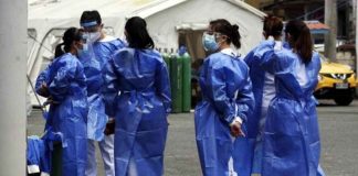Medical workers get ready for their shift at the Santa Ana Hospital in Manila. This photo was taken in March 2021. FILE PHOTO BY MARIANNE BERMUDEZ / PHILIPPINE DAILY INQUIRER