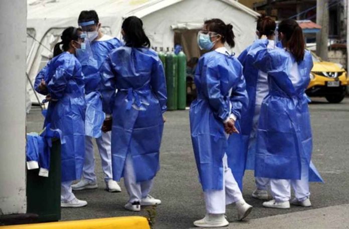 nurses Medical workers get ready for their shift at the Santa Ana Hospital in Manila. This photo was taken in March 2021. FILE PHOTO BY MARIANNE BERMUDEZ / PHILIPPINE DAILY INQUIRER