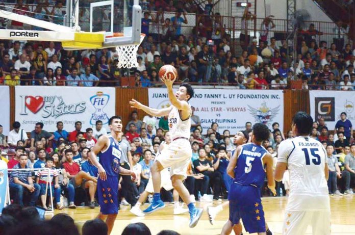 sports-PBA Negrense Jeffrei Chan of Visayas All-Stars goes for a layup in their match against Gilas Pilipinas All-Stars in the Visayas leg of the 2018 PBA All-Stars on May 27, 2018 at the University of San Agustin Gym in Iloilo City. FILE PHOTO
