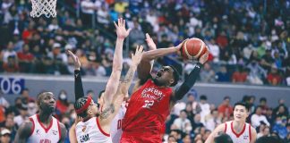 Barangay Ginebra San Miguel Kings’ Justin Brownlee is forced to a tough basket by Bay Area Dragons’ Kobey Lam. PBA PHOTO