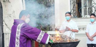 A Jaro Metropolitan Cathedral priest yesterday burned consecrated palms from last year’s Palm Sunday for tomorrow’s Ash Wednesday. JARO METROPOLITAN CATHEDRAL FACEBOOK PAGE PHOTO