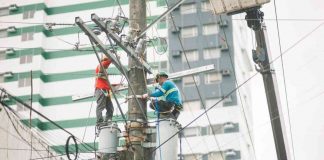 MORE Electric and Power Corporation’s (MORE Power) continuing drop in power rates brings relief to consumers in Iloilo City. Photo shows MORE Power linemen fixing a power line.