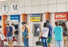 People are queuing to withdraw cash from automated teller machines. The World Bank said only 51 percent of Filipinos aged 15 and above are having a transaction account with a financial institution. AFD/EZRA ACAYAN PHOTO