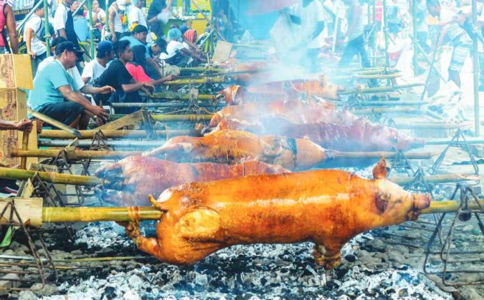 arevalo lechon Lechon is a whole roasted adult pig that is slowly rotated over an open charcoal grill to achieve a crisp skin and succulently tender meat. Lechon from Arevalo, Iloilo City is among the best in the Philippines, according to residents there. PN FILE PHOTO
