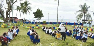 Students, teachers and faculty of Paaralan ng Buhay ng Tando in Nueva Valencia, Guimaras perform the "drop, cover, hold, clear, and out" scenario during the earthquake drill. PROVINCE OF GUIMARAS FACEBOOK PAGE