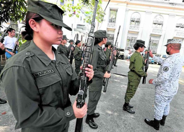 nation group BY CHOICE. Students undergoing military training by choice perform rifle-handling drills under an instructor in this photo taken on a Manila campus on Jan. 28, 2023. File photo by MARIANNE BERMUDEZ / Philippine Daily Inquirer