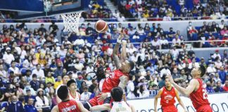 Barangay Ginebra San Miguel Kings’ Jamie Malonzo is forced to a tough basket by Rain or Shine Elasto Painters' defense. PBA PHOTO
