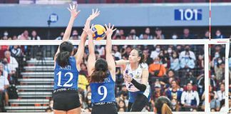 Ilongga Princess Robles of National University Lady Bulldogs scores against two Ateneo de Manila University Blue Eagles defenders. UAAP PHOTO