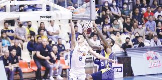 TNT Tropang Giga's Calvin Oftana goes for a layup as Magnolia Chicken Timplados Hotshots' Erik McCree attempts a block. PBA PHOTO