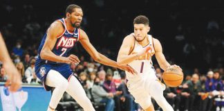 Kevin Durant (left) will now team up with Devin Booker (right) at Phoenix Suns. GETTY IMAGES