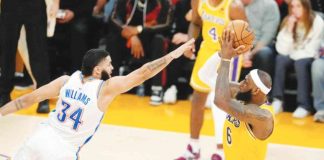 SHOT AT HISTORY. Los Angeles Lakers' LeBron James with a fadeaway shot over Oklahoma City Thunder's Kenrich Williams to clinch the no.1 spot in NBA's career scoring leader in the regular season. GETTY IMAGES