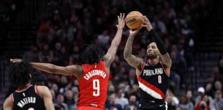 Portland Trail Blazers’ Damian Lillard shoots over the defense of Houston Rockets' Josh Christopher. YAHOO SPORTS PHOTO