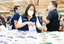 Department of Trade and Industry personnel track prices of sugar in a supermarket in Manila. High prices of sugar were among the factors that pushed inflation up in the later months of 2022. DTI PHOTO