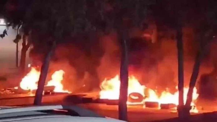 world iran Footage posted by Kurdish rights group Hengaw purportedly showing burning tyres blocking a road in Sanandaj during an anti-government protest in Iran. BBC