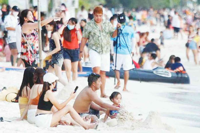 Boracay Tourists enjoy the beach in Boracay’s Station 2. Boracay remains among the top destination for domestic travel. ABS-CBN NEWS/FILE PHOTO