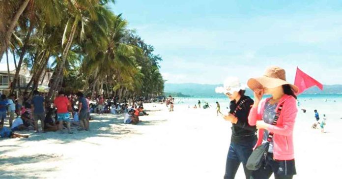 boracay Tourists enjoy the world-renowned Boracay Island. China already allowed outbound group travel for Chinese citizens to more than a dozen countries, including the Philippines, reviving hopes for the pandemic-hit tourism sector. PNA FILE PHOTO