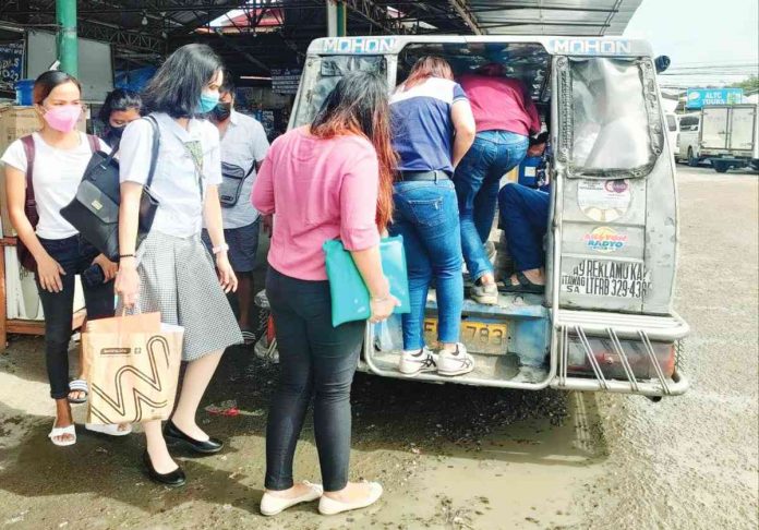 jeep 1 Drivers Carlos Deasis and Jayson Tandog welcome the extension of the validity of the franchises of traditional jeepneys from June 30 to Dec. 31, 2023 but stress they’ll be happier if the phaseout of traditional jeepneys won’t push through. Right photo shows passengers boarding a traditional jeepney at the Mohon terminal in Arevalo, Iloilo City. AJ PALCULLO/PN