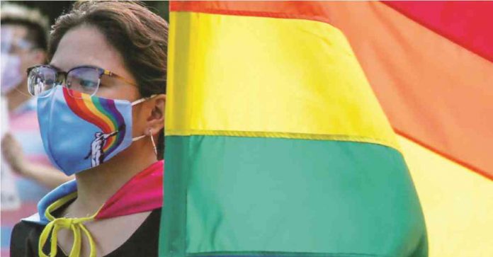 jobmarket-lgbt Members of the LGBT community carry rainbow flags and shout slogans during the UP Pride March in UP Diliman. JONATHAN CELLONA, ABS-CBN NEWS/FILE PHOTO