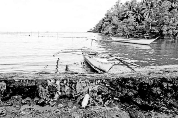 DESERTED. Fishing boats are left idle along the shoreline of Pola, Oriental Mindoro in this photo taken on Thursday, March 9, 2023, following the widespread oil spill that affects the livelihood of local fishermen. PHOTO COURTESY OF NOEL GUEVARA OF GREENPEACE