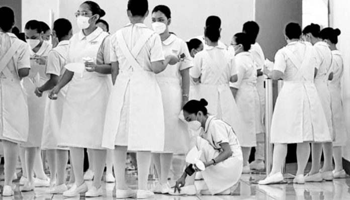 nation nurses One in 20 nurses in the United States is Filipino, following decades of migration of nurses from the Philippines, which is now lacking 106,000 nurses, to American soil. Here, future nurses from Centro Escolar University are at the World Trade Center in Pasay City for their capping and pinning rites, on Sept. 30, 2022. File photo by RICHARD A. REYES / Philippine Daily Inquirer
