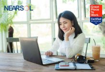 Young Asian businesswoman working online with laptop computer while sitting in coffee shop. Self-employed and freelance worker business activity concept.