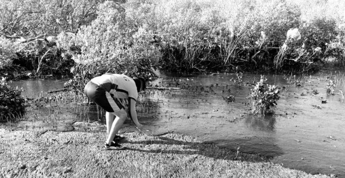 The Philippine Coast Guard (PCG) Maritime Environmental Protection Force Western Visayas, PCG-Semirara substation, and barangay officials collect oil sludge in Barangay Tinogboc, Caluya, Antique. COAST GUARD DISTRICT WESTERN VISAYAS