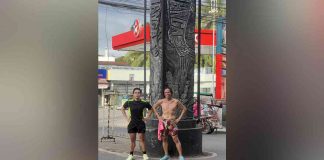 Runner Ss James Maguillo (left) with writer Peter Solis Nery at the Dumangas Obelisk, the start and end point of their 11.8 km morning run on March 15.