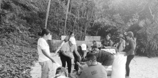 Personnel of the Philippine Coast Guard - Aklan, Philippine National Police, Municipal Disaster Risk Reduction and Management Office, and local government unit of Malay make improvised oil spill booms using bamboo and rice hay near the beachfront of Puka Beach, Barangay Yapak, Boracay Island, Malay, Aklan in preparation for a possible oil spill. PCG – AKLAN VIA PCG-WV PHOTO