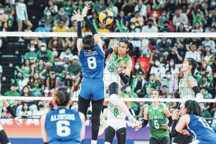 sports DLSU Bacolodnon Angel Canino of De La Salle University Lady Spikers fired a shot against National University Lady Bulldogs’ Sheena Toring. UAAP PHOTO