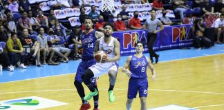 TNT Tropang Giga’s Mikey Williams goes for a tough basket against two Meralco Bolts defenders. PBA PHOTO