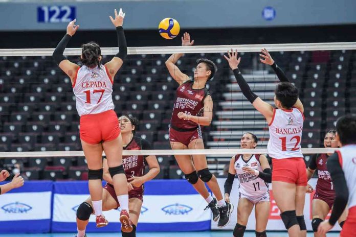 sports UP pic and caption Negrense Alyssa Bertolano of the University of the Philippines Fighting Maroons goes for an attack against a University of the East Red Warriors defender. UAAP PHOTO
