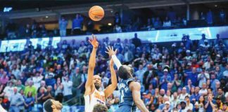 Phoenix Suns' Kevin Durant with his go-ahead jumper against the defense of Dallas Mavericks' Tim Hardaway Jr. and Kyrie Irving. PHOTO BY GARETH PATTERSON/AP