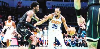 Phoenix Suns’ Kevin Durant tries to break away from the defense of Charlotte Hornets’ Mark Williams. AFP PHOTO