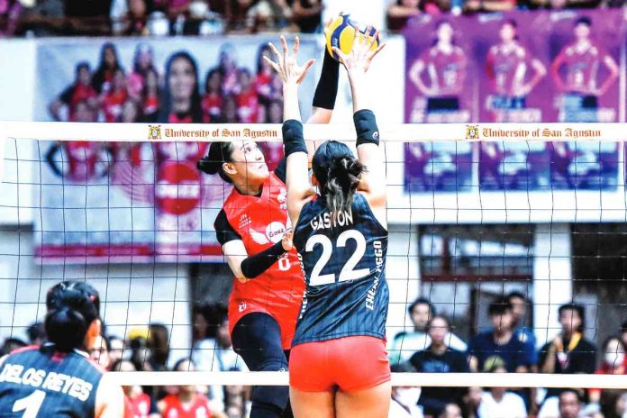 Ilongga Aiza Maizo-Pontillas of Petro Gazz Angels attempts a shot against Chery Tiggo Crossovers’ Pauline Gaston during their 2023 Premier Volleyball League All-Filipino Conference game last night at the University of San Agustin Gym in Iloilo City. PVL PHOTO