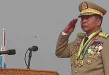 Myanmar vows to crush resistance General Min Aung Hlaing stands at a podium and salutes. MYAWADY MEDIA PHOTO