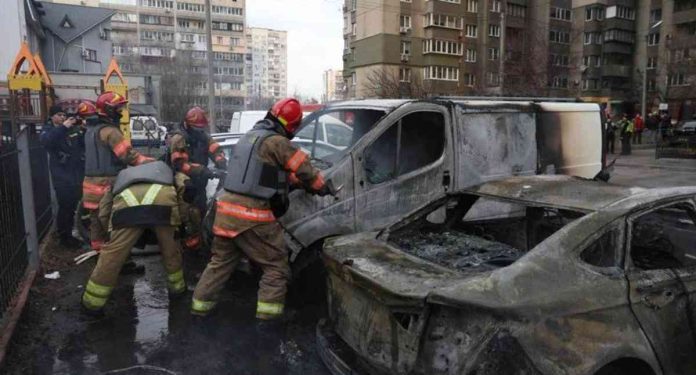 world russia Emergency workers attended burning cars damaged by the Russian missile strikes in Kyiv, the capital of Ukraine. REUTERS