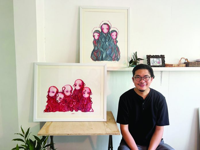 1_resized Painter Julius Redillas, first artist-in-residence of Istaran, with two of his watercolors (now in private collections) produced during his two-month residency in KANTINA, Roxas City.