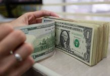 PH gross reserves hit $100.2B in March A store clerk counts their US dollar bills inside a money changer stall in Manila. The Philippine peso fell to a new record low for the fourth straight day on Wednesday, April 5, closing at P58.50 against the US dollar. GEORGE CALVELO/ABS-CBN NEWS PHOTO