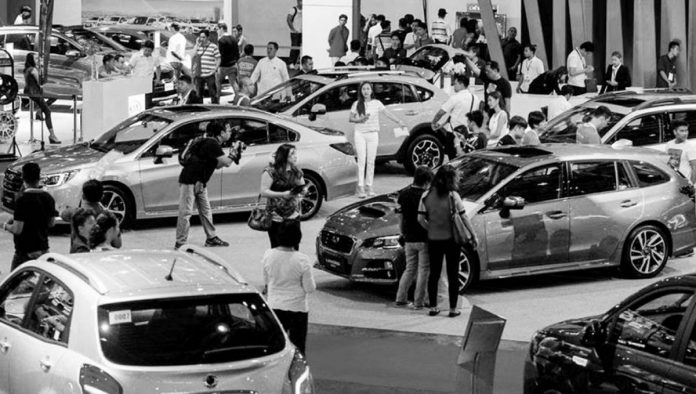 Visitors view cars on exhibit at the Manila International Auto Show at the World Trade Center in Pasay City. JONATHAN CELLONA/ABS-CBN NEWS/FILE PHOTO