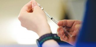 A nurse fills up a syringe with the coronavirus disease vaccines in this file photo. REUTERS