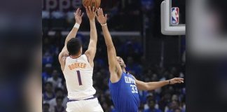 Phoenix Suns’ Devin Booker goes for the basket as LA Clippers’ Nicolas Batum tries to block the shot. AP