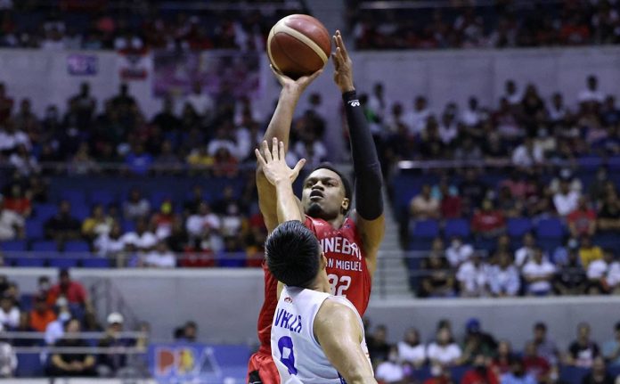sports PBA pic and caption Barangay Ginebra San Miguel Kings’ Justin Brownlee pulls up for a shot against the defense of Negrense Paul Varilla of TNT Tropang Giga. PBA PHOTO